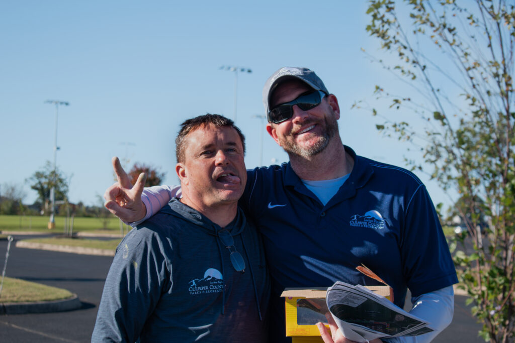 Two men smiling and posing for the camera.