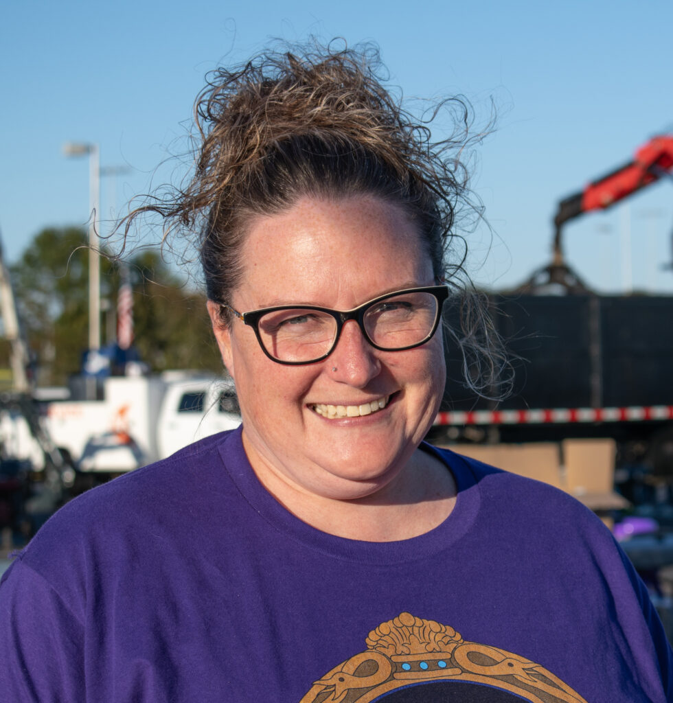 A woman smiling at the camera.