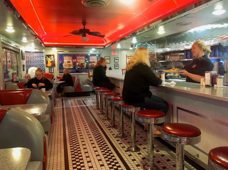 Cafe with multiple versions of the same woman.